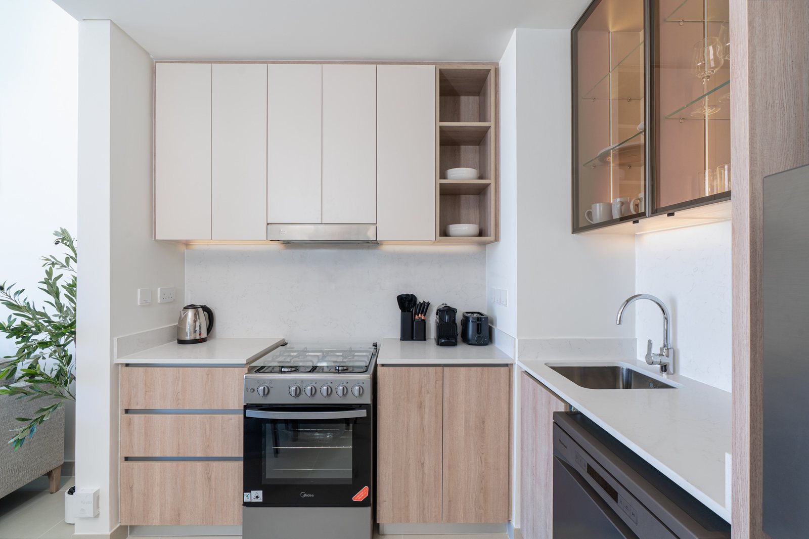 Kitchen with oven, kettle, coffee machine and toaster